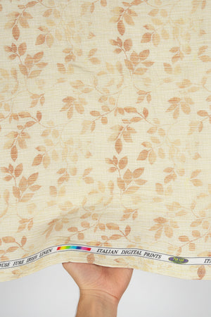 Fabric with leaf pattern and visible brand label at the top.