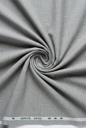 Light grey Arvind Lycra stretchable suiting fabric showing smooth, flexible textile with subtle texture for tailored garments.