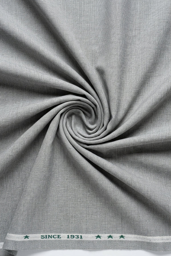 Light grey Arvind Lycra stretchable suiting fabric showing smooth, flexible textile with subtle texture for tailored garments.