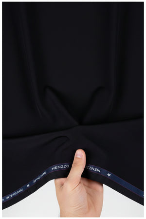 Black Mafatlal poly viscose trousers and suiting fabric, showing fabric texture and tailored fit details.