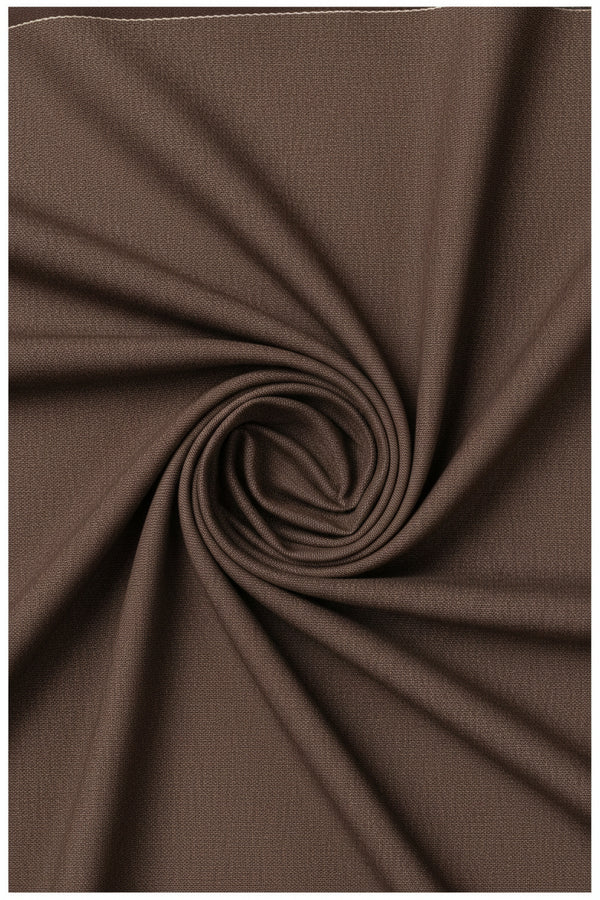 A close-up of raymond brown textured fabric twirled drape image