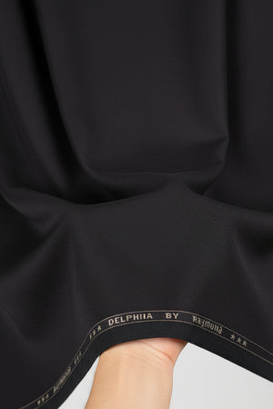 Brown Raymond poly viscose trousers and suiting fabric, close-up of fabric texture and color.