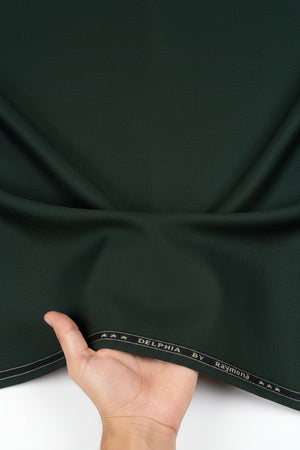 Raymond unstitched poly viscose trousers and suiting fabric in seaweed green, fabric swatch with folded edges and textured surface.
