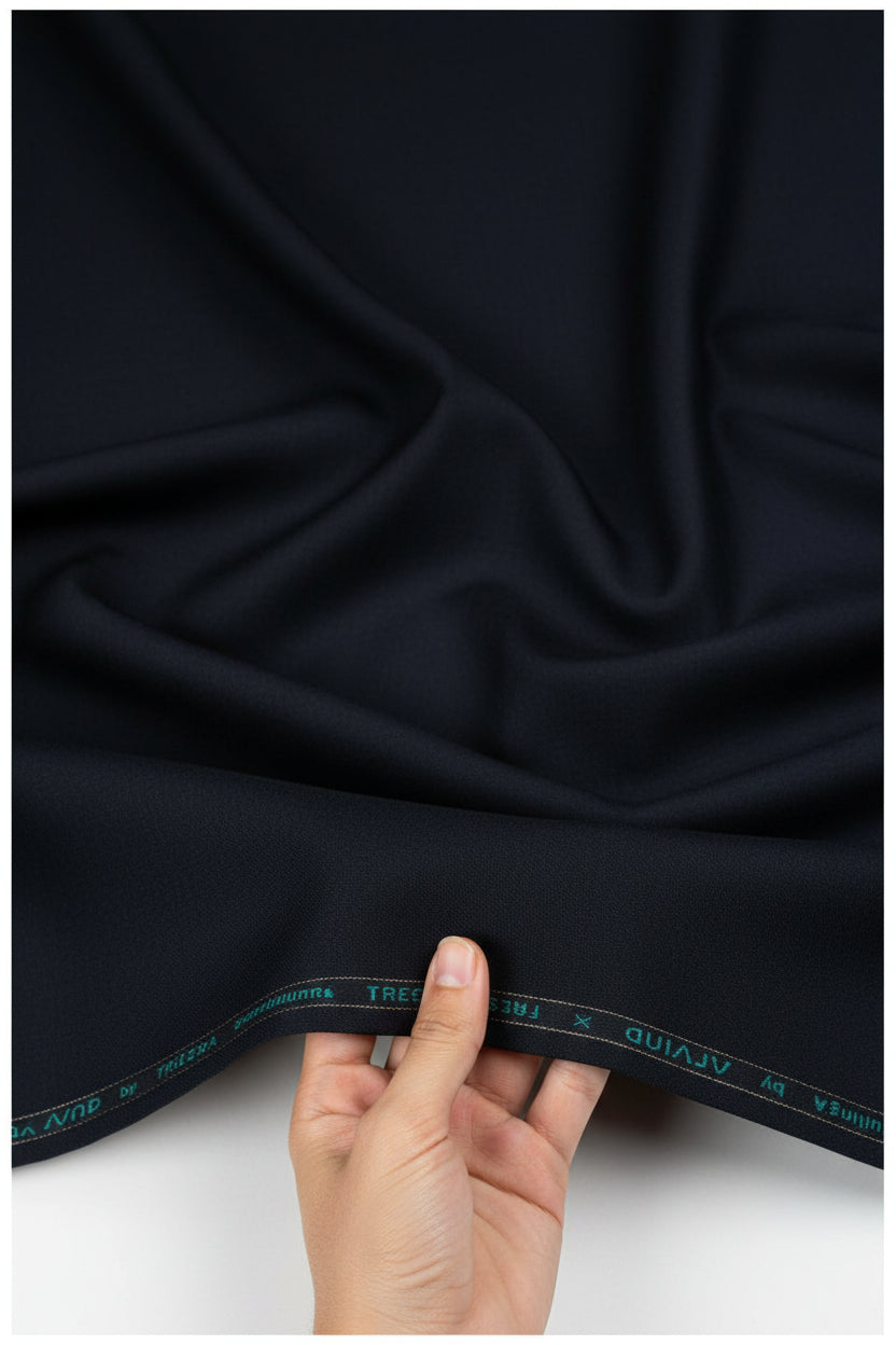 Dark navy blue Arvind Polyviscose trousers and suiting fabric, close-up of textured fabric with subtle sheen and weave details.