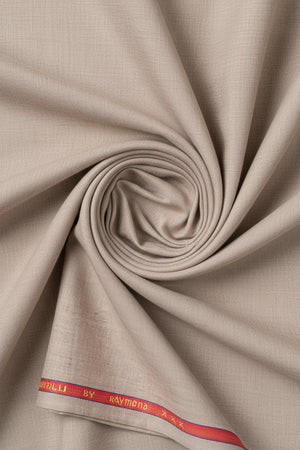 Raymond unstitched poly viscose trousers and beige suiting fabric, tan color, fabric texture visible for custom tailoring.