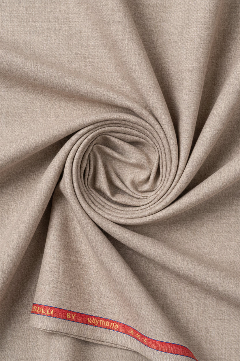 Raymond unstitched poly viscose trousers and beige suiting fabric, tan color, fabric texture visible for custom tailoring.