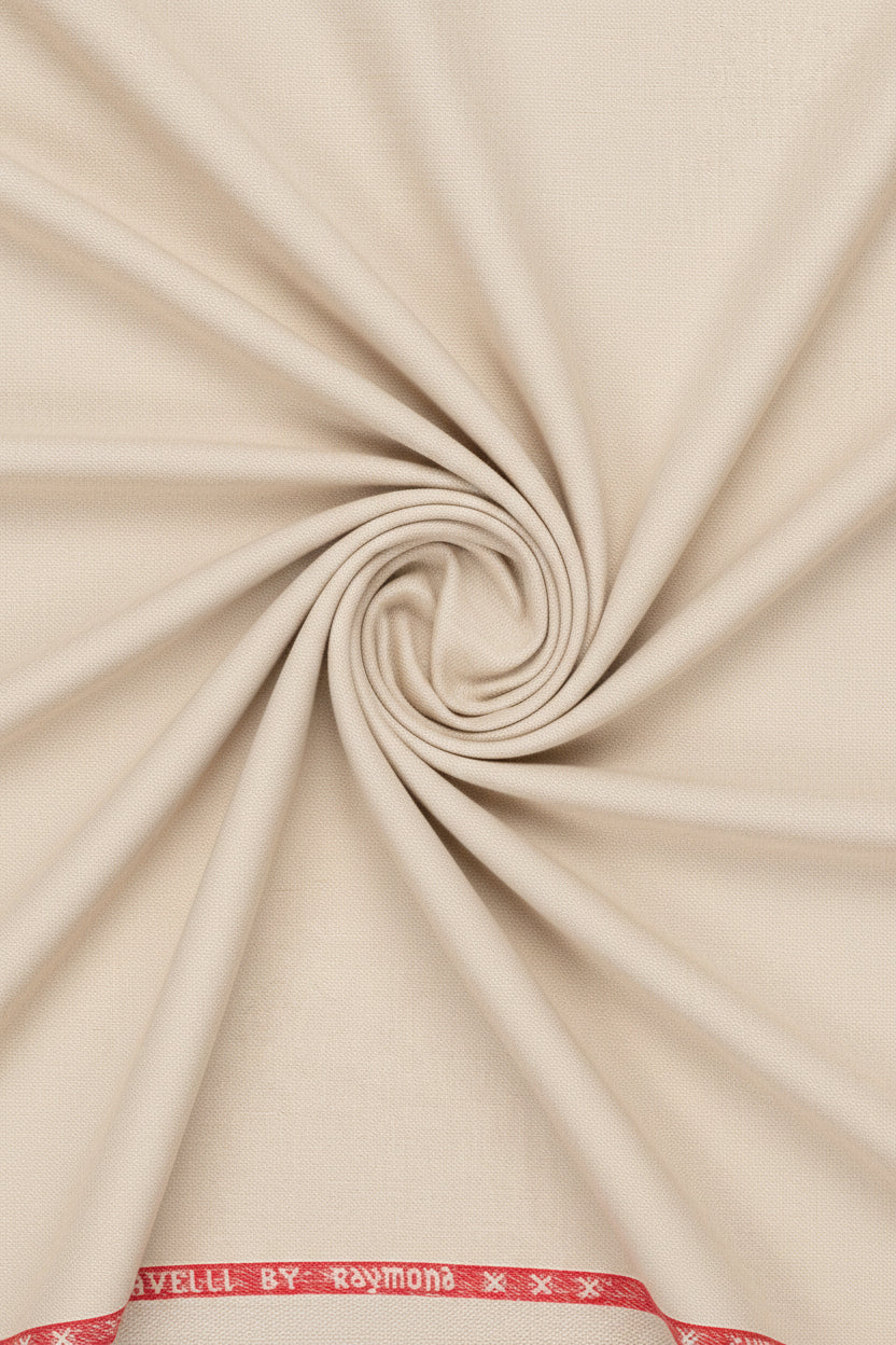 Raymond unstitched poly viscose trousers and suiting fabric in sand beige, fabric swatch with textured appearance and folded edges.
