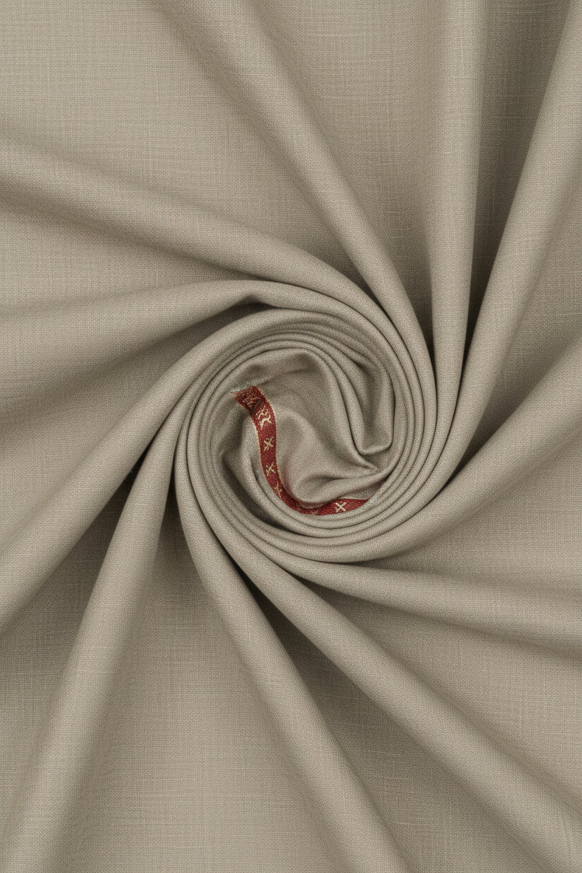 Beige Raymond unstitched poly wool trouser fabric, suitable for tailoring and sewing, with a smooth, woven texture.