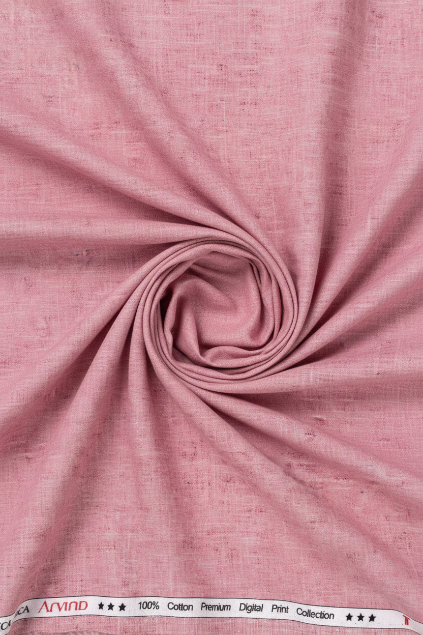 Rose pink Tresca cotton digital print shirting fabric by Arvind, showcasing a detailed pattern on soft, luxurious textile.