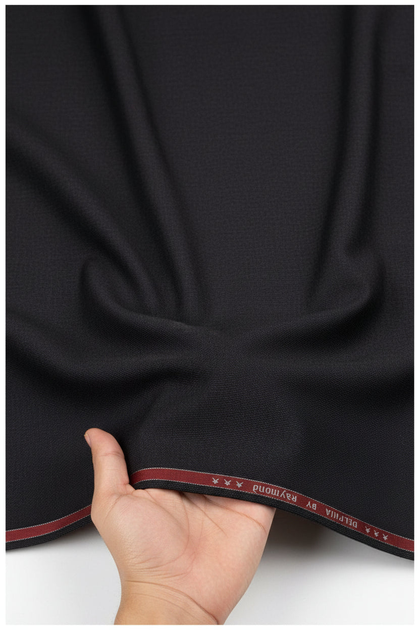 Raymond unstitched poly-viscose trousers and suiting fabric in licorice brown, fabric swatch with textured weave and folded edges.