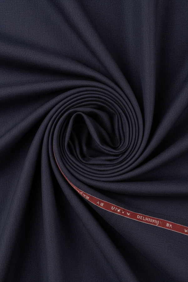 Raymond violet wine poly viscose suiting fabric close-up showing smooth, woven textile with a soft sheen and vibrant color.