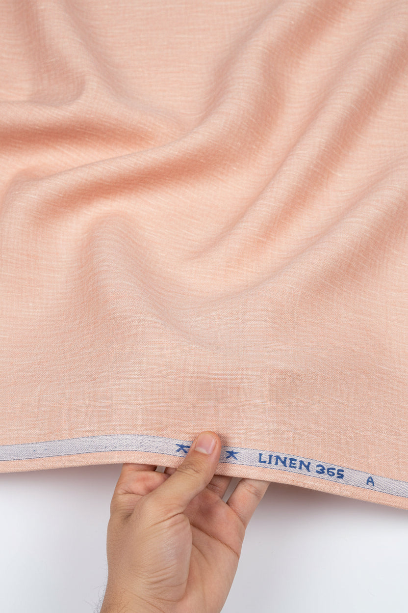 Deep peach Arvind linen shirt fabric with a plain, smooth texture, ideal for unstitched shirt designs