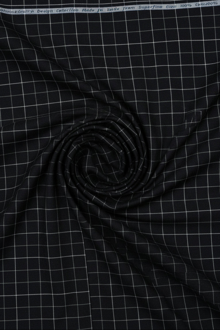 Black fabric with a grid pattern on a black background