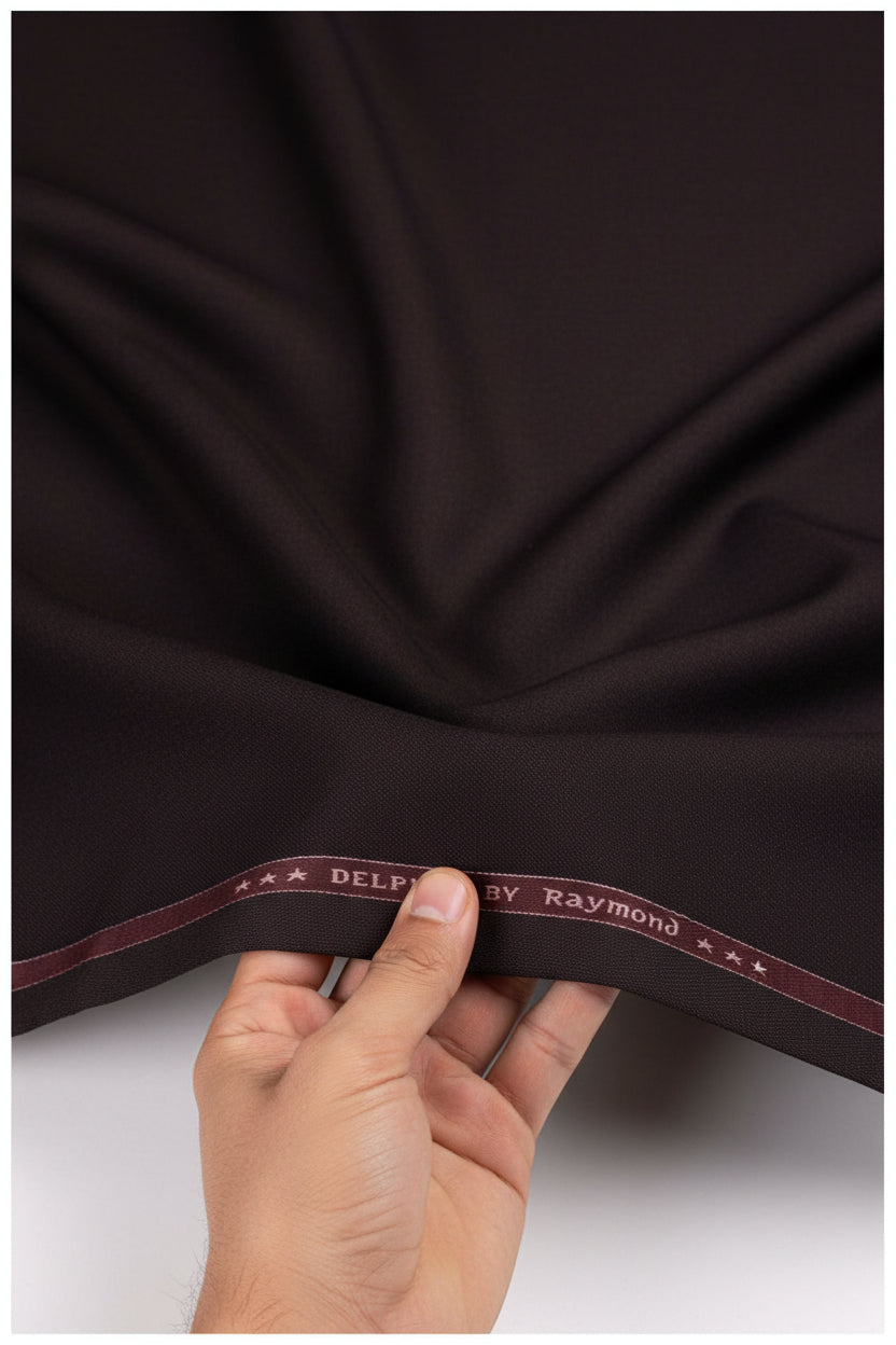 Raymond brown poly viscose trouser and suiting fabric, close-up of textured textile material for formal wear.