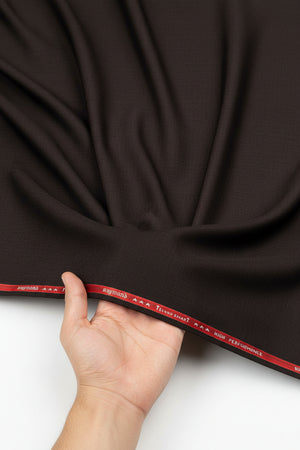 Raymond Polywool trousers and suiting fabric in coffee brown, showcasing the textured textile and tailored design.