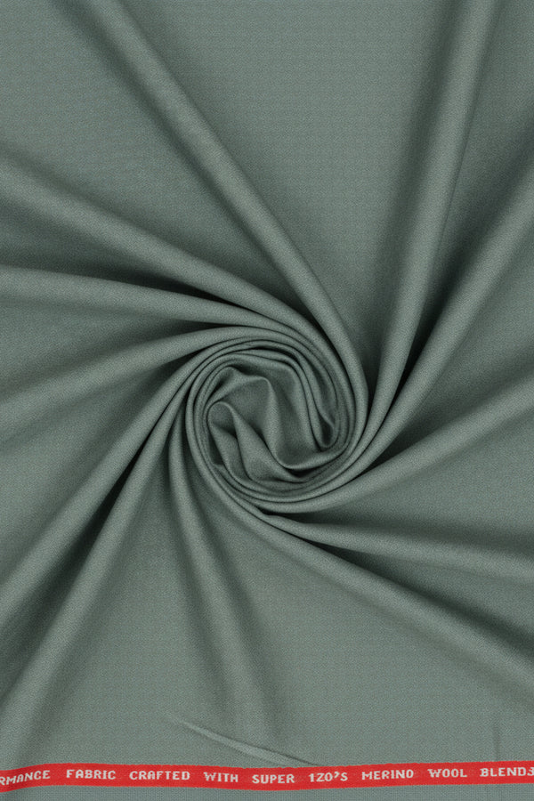 Raymond Polywool suiting fabric in Pista Green with Super 120's Merino wool, showing close-up of textured fabric detail.