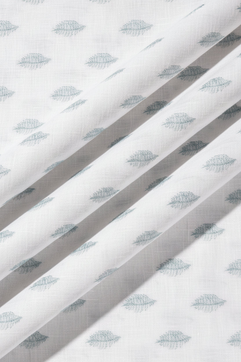 Textured white paper with blue leaf pattern