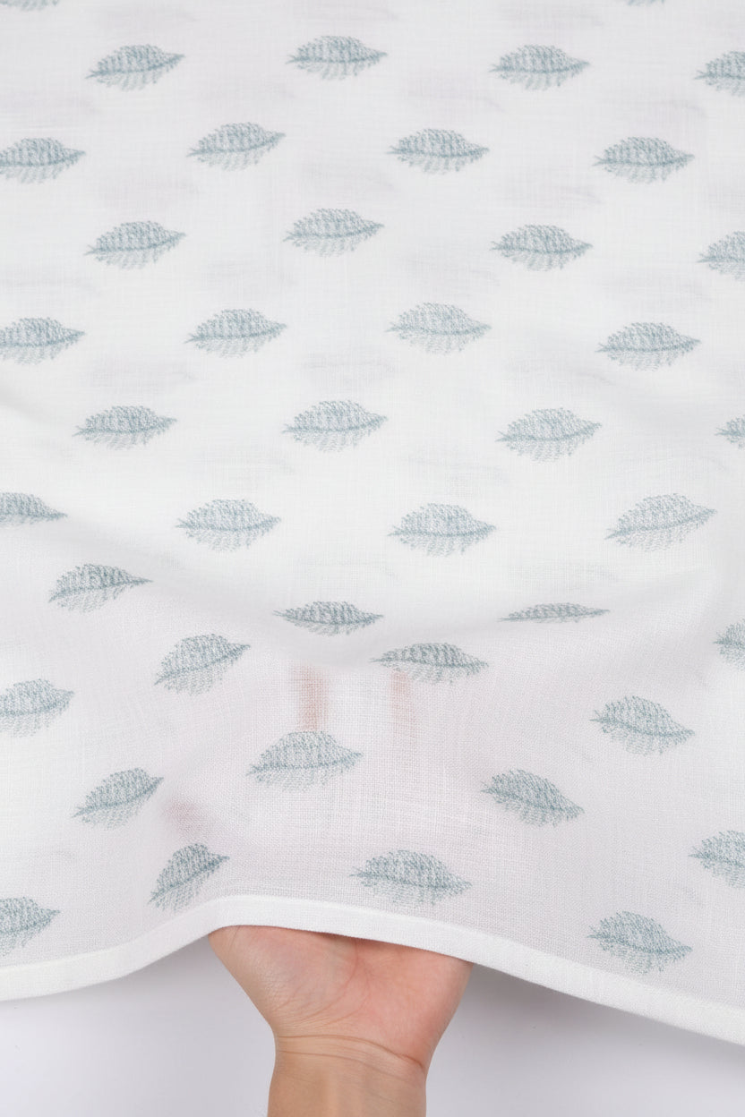 Textured white paper with blue leaf pattern