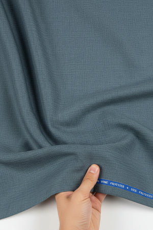 Grey Raymond Super 120’s poly wool trouser and suiting fabric, close-up of textured grey fabric for formal suit tailoring.