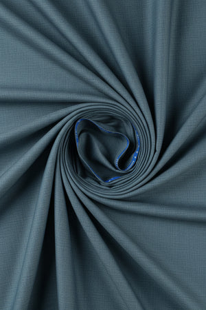 Grey Raymond Super 120’s poly wool trouser and suiting fabric, close-up of textured fabric with subtle weave details.