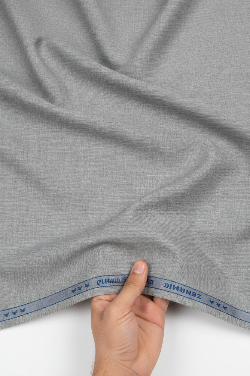 Gray cloud polyviscose trousers and suiting fabric by Raymond, unstitched fabric for custom tailoring, detailed fabric texture visible.