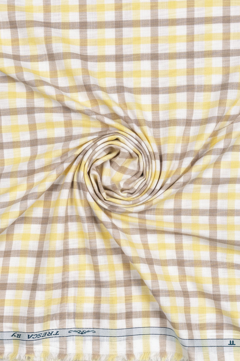 Yellow and brown check Tresca cotton shirting fabric by Arvind, featuring a white background and unstitched, luxurious cotton material.