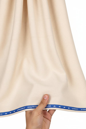 Raymond ivory polywool trousers and suiting fabric, showing a close-up of the textured fabric with tailored details.