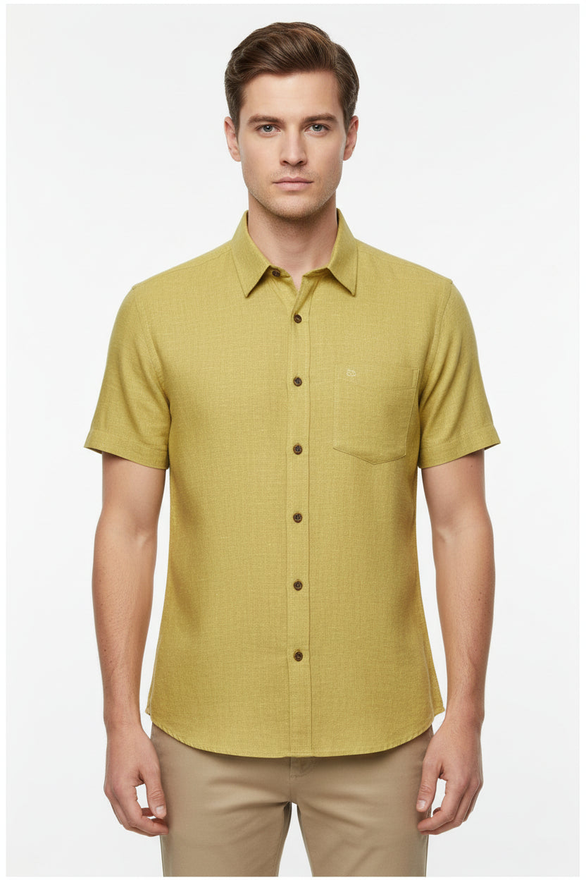 Arvind plain linen shirt fabric in hazelnut yellow, showing soft textured linen material with subtle color variation