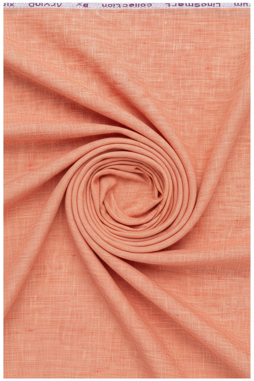 Arvind pure linen shirt fabric in carrot orange, unstitched material with a smooth texture and vibrant color for custom tailoring.