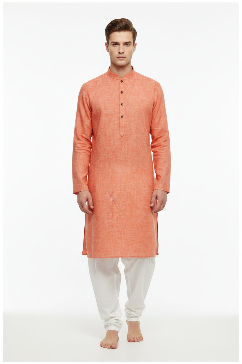 Arvind pure linen shirt fabric in carrot orange, unstitched, showing the textured linen material and vibrant color.