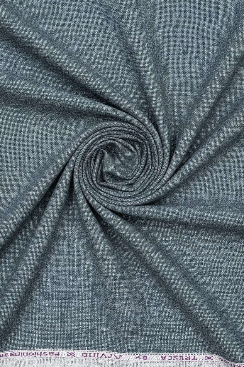 Grey linen trouser and suiting fabric by Arvind, unstitched material for custom-made clothing, detailed textile pattern visible.