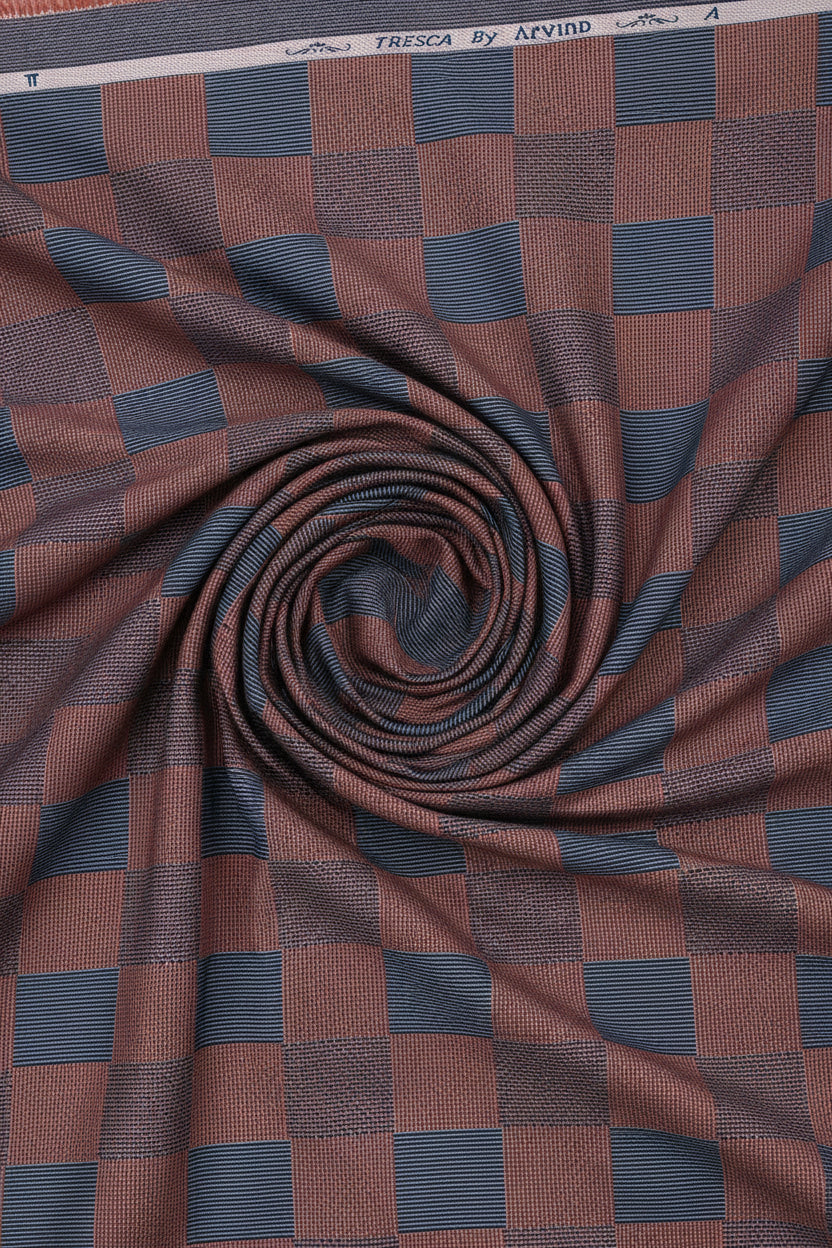 Brown and blue check Tresca cotton shirting fabric by Arvind, showing a close-up of the unstitched fabric with checked pattern.