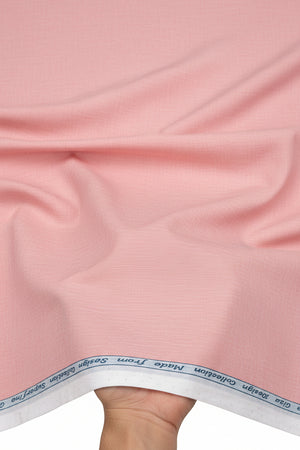 Arvind Giza Cotton Shirting Fabric in Misty Rose, showcasing soft pink, lightweight cotton material with a smooth texture.