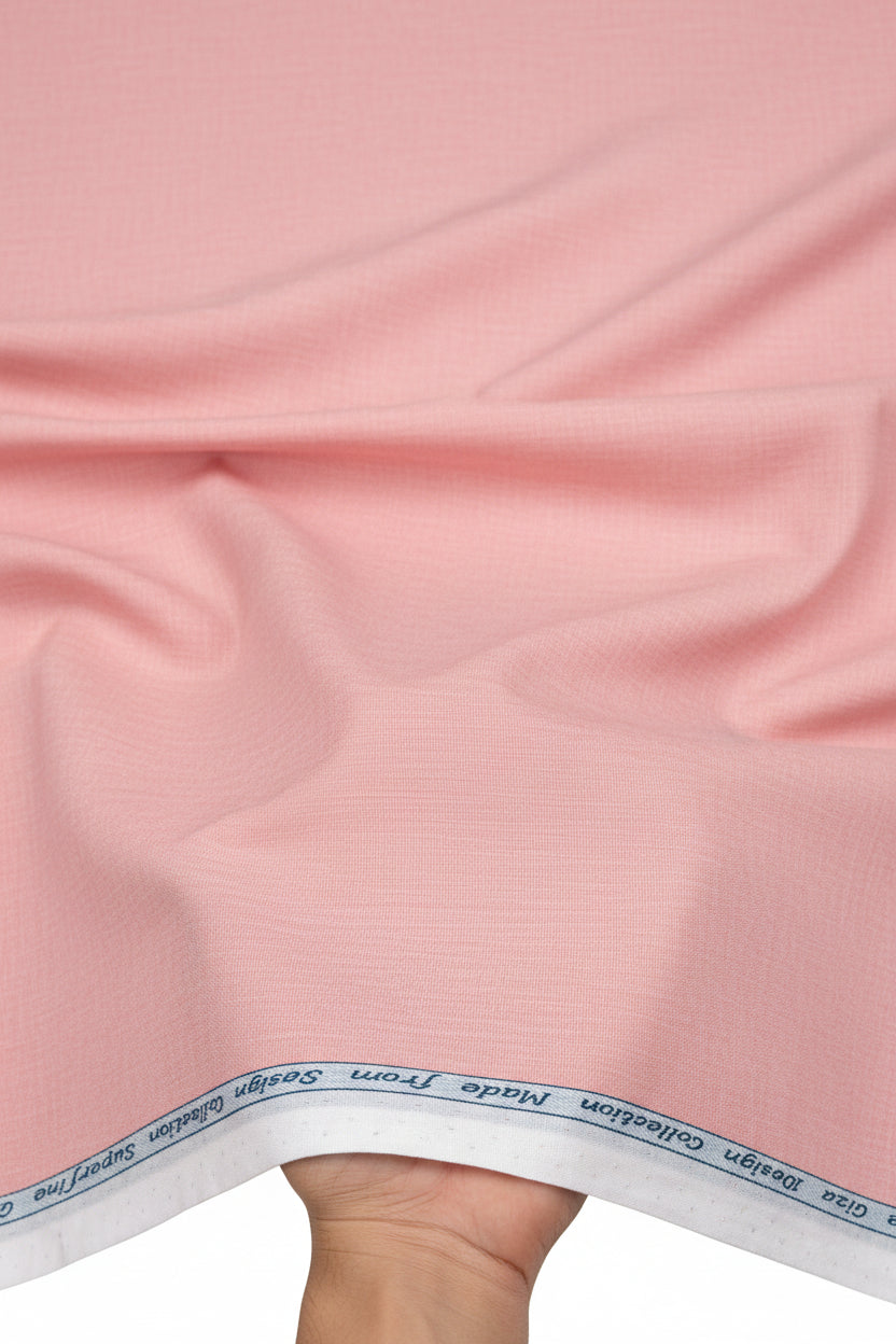 Arvind Giza Cotton Shirting Fabric in Misty Rose, showcasing soft pink, lightweight cotton material with a smooth texture.