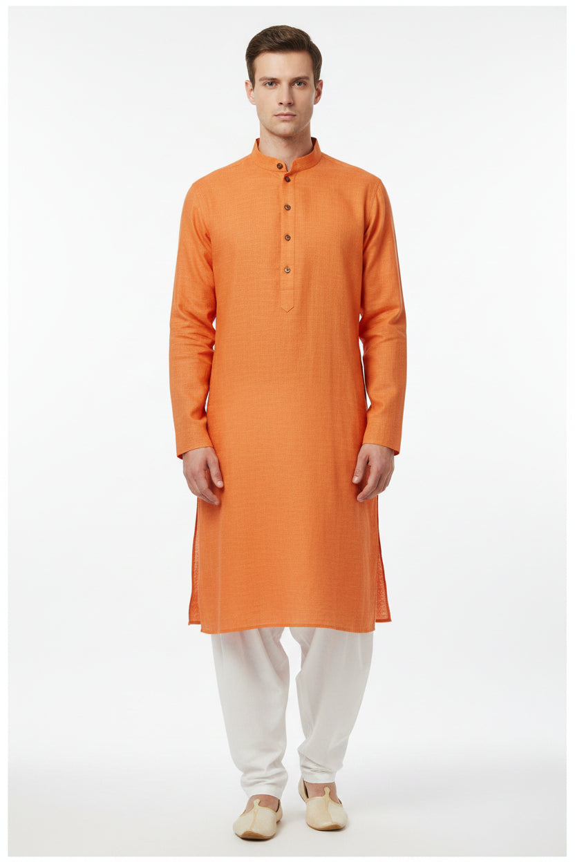 Orange Arvind Tresca cotton unstitched shirting fabric with a smooth, woven texture suitable for custom shirts.