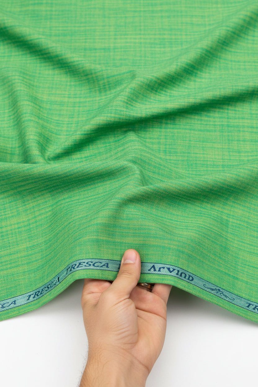 Green Arvind Tresca cotton unstitched shirting fabric with a smooth, woven texture ideal for custom shirts.