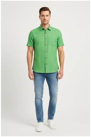 Green Arvind Tresca cotton unstitched shirting fabric roll with intricate weave details, ideal for custom shirts.