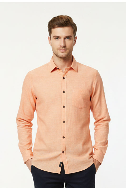 Light orange Arvind Tresca cotton unstitched shirting fabric with a soft, smooth texture and classic woven pattern.