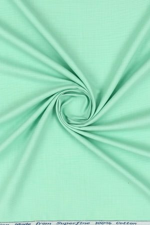 Mint green Arvind cotton shirting fabric with a smooth texture and subtle weave pattern, ideal for stylish shirts.