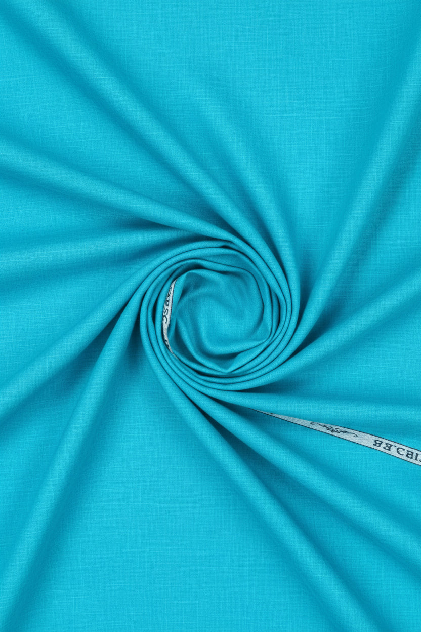 Blue Arvind Tresca cotton shirting fabric with a smooth, woven texture, suitable for dress shirts and tailored garments.