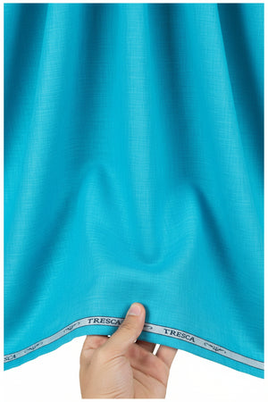 Blue Arvind Tresca cotton shirting fabric shown in close-up with a smooth, woven texture for tailored shirts.