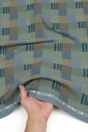 Olive green Tresca cotton shirting fabric by Arvind with a smooth, unstitched texture and subtle woven pattern.