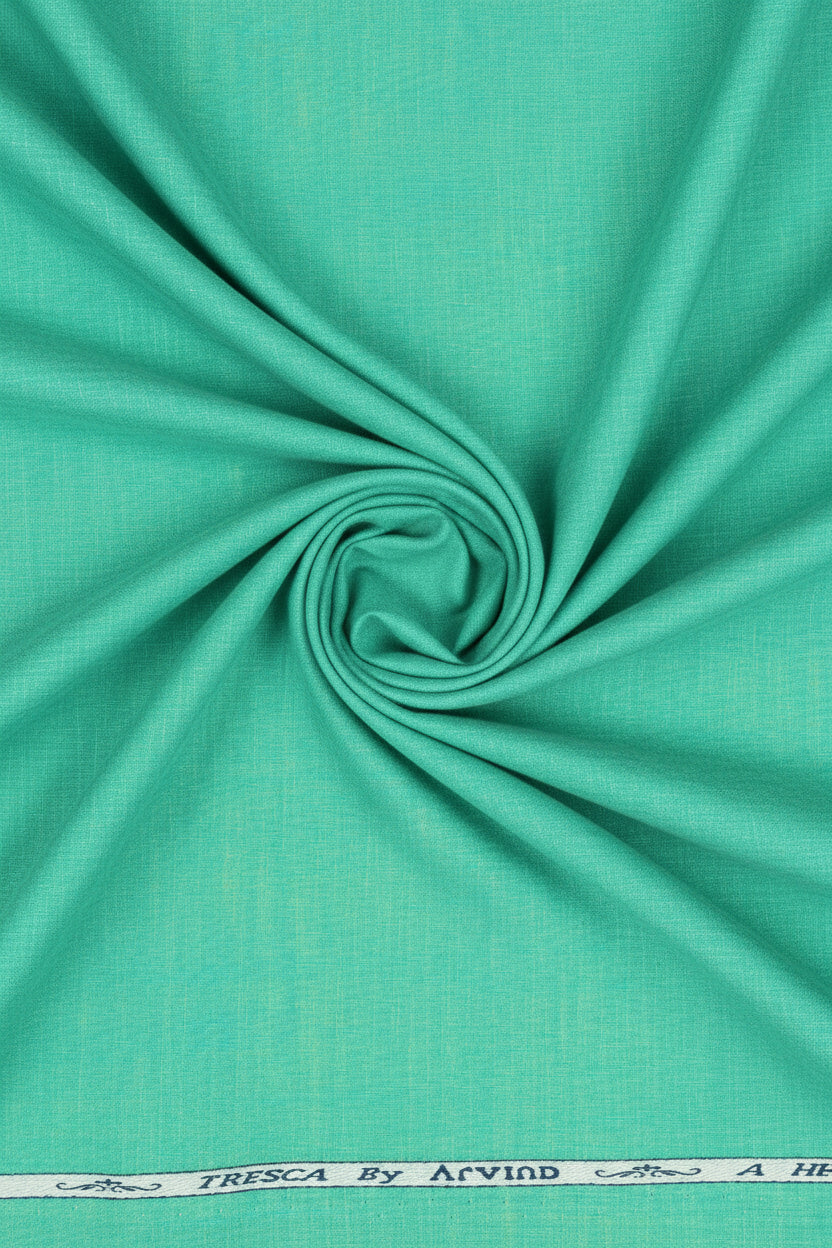Aquamarine green Arvind Tresca cotton shirting fabric, close-up of textured woven material with vibrant color and soft finish.