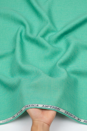 Aquamarine green Arvind Tresca cotton shirting fabric shown in close-up, highlighting its smooth texture and vibrant color.