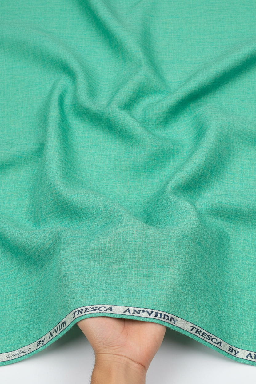 Aquamarine green Arvind Tresca cotton shirting fabric shown in close-up, highlighting its smooth texture and vibrant color.
