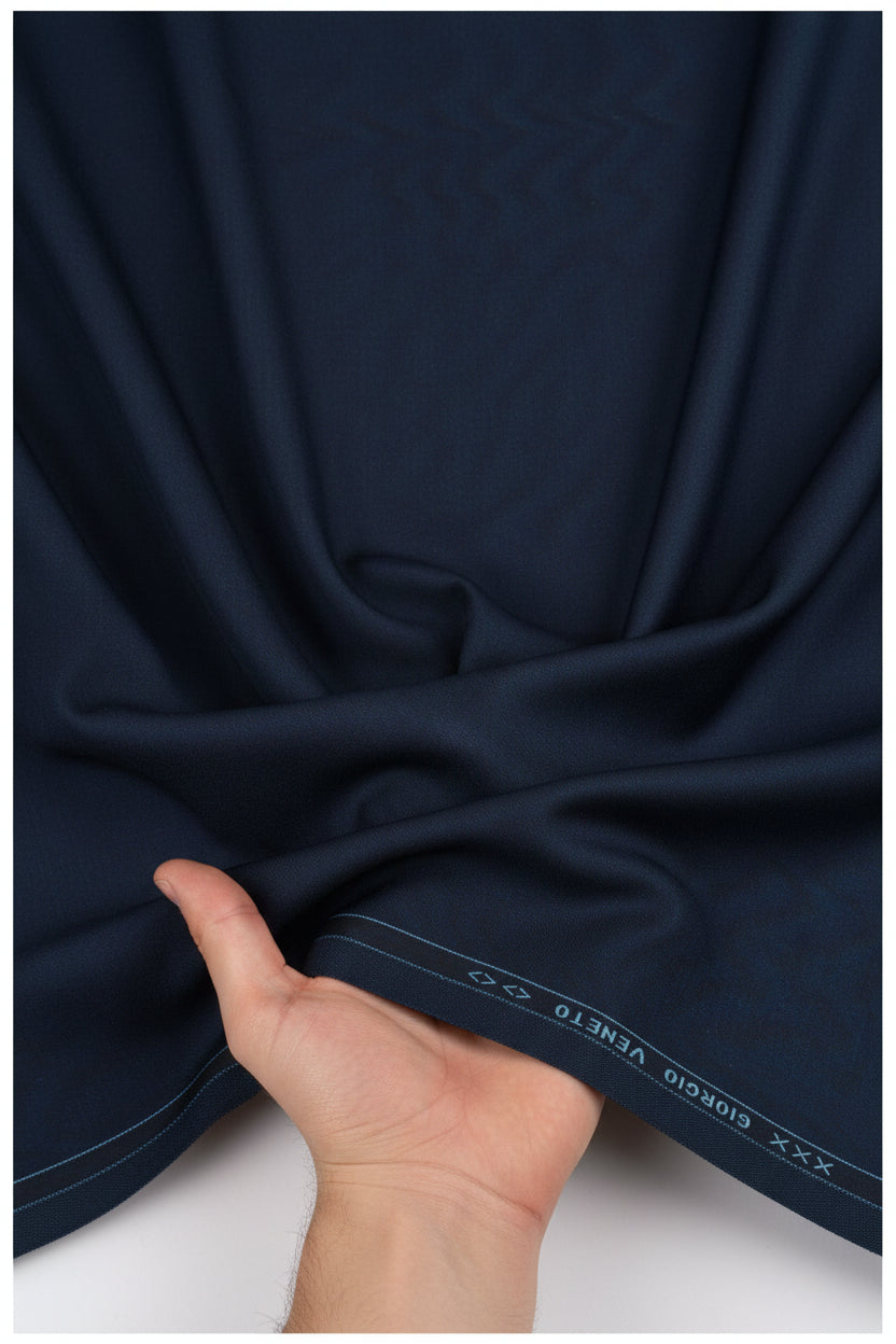 Georgia Veneto 150’s Italian poly wool suiting fabric in midnight blue, featuring a smooth, tailored textile from Georgia Gullini of Italy.