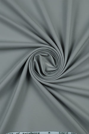 Grey Mafatlal unstitched poly viscose trouser and suiting fabric, shown in a fabric roll with detailed texture.