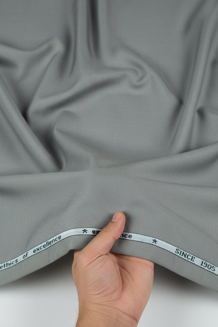 Grey Mafatlal unstitched poly viscose trouser and suiting fabric, showcasing soft, woven textile for tailoring or fashion design.