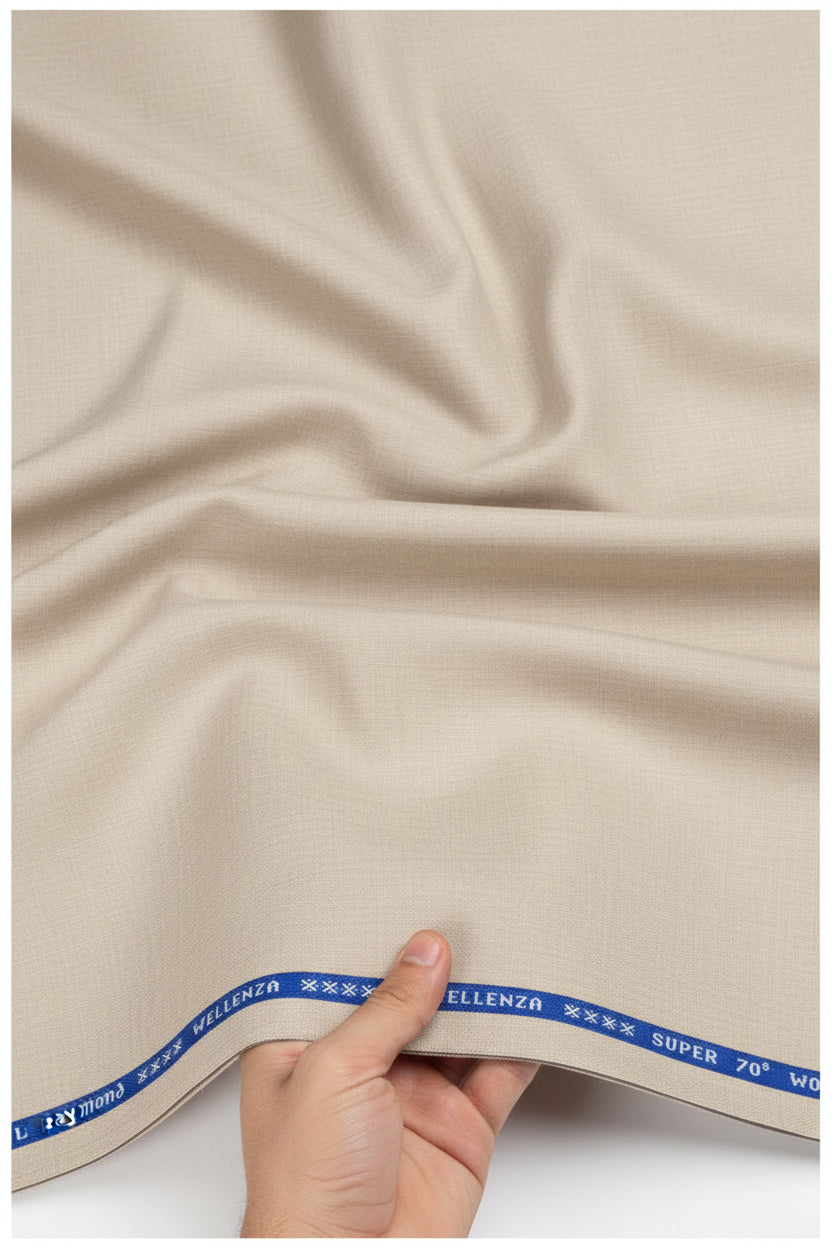 Ivory Raymond Luxurious Unstitched Super 70's Polywool fabric for trousers and suiting, displayed in roll on a flat surface