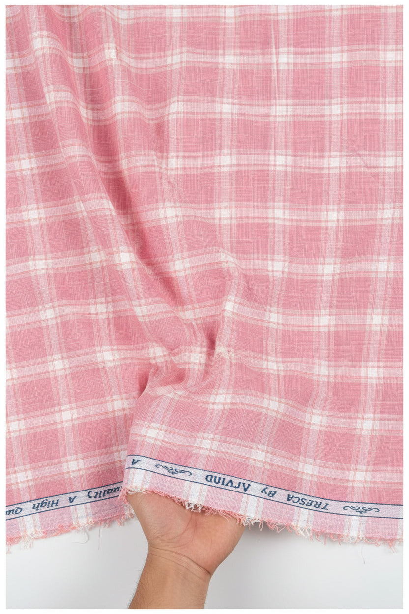 Pink and white plaid fabric with 'Tresca by Arvind' branding on a white background